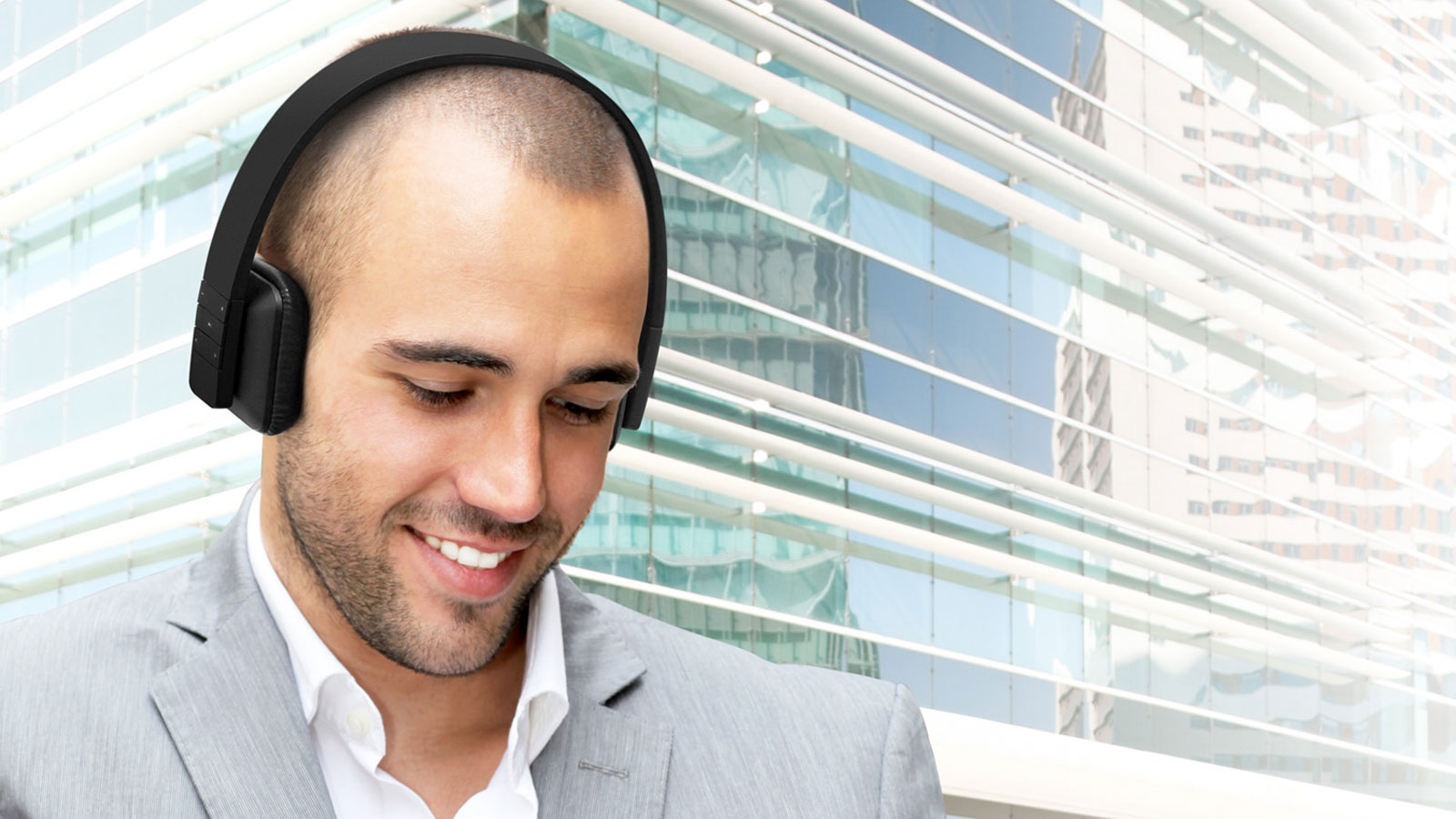 Smiling man wearing Aluratek headphones