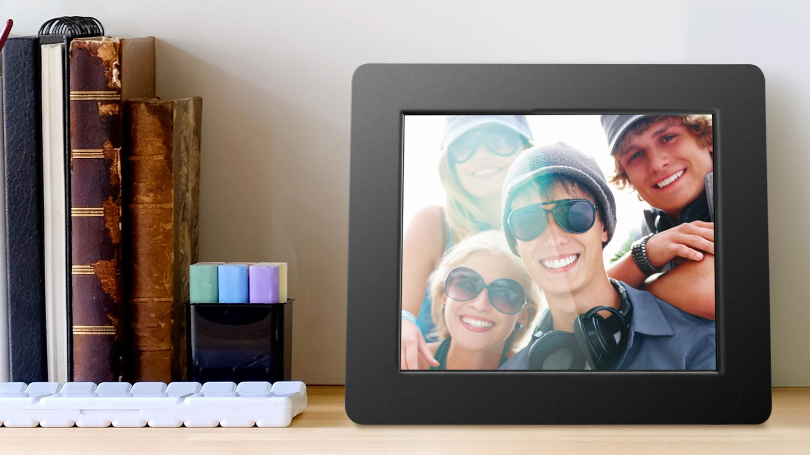 Aluratek Digital Photo Frame on Shelf with Books