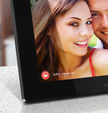Aluratek Digital Photo Frame on Counter and Young Couple