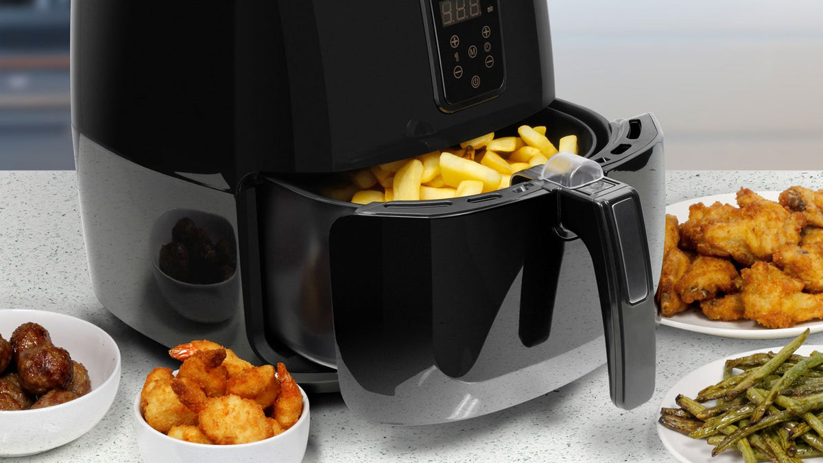 An Aluratek air fryer on a counter