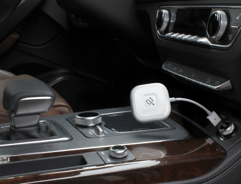 Wireless Adapter for Apple CarPlay Plugged into a car