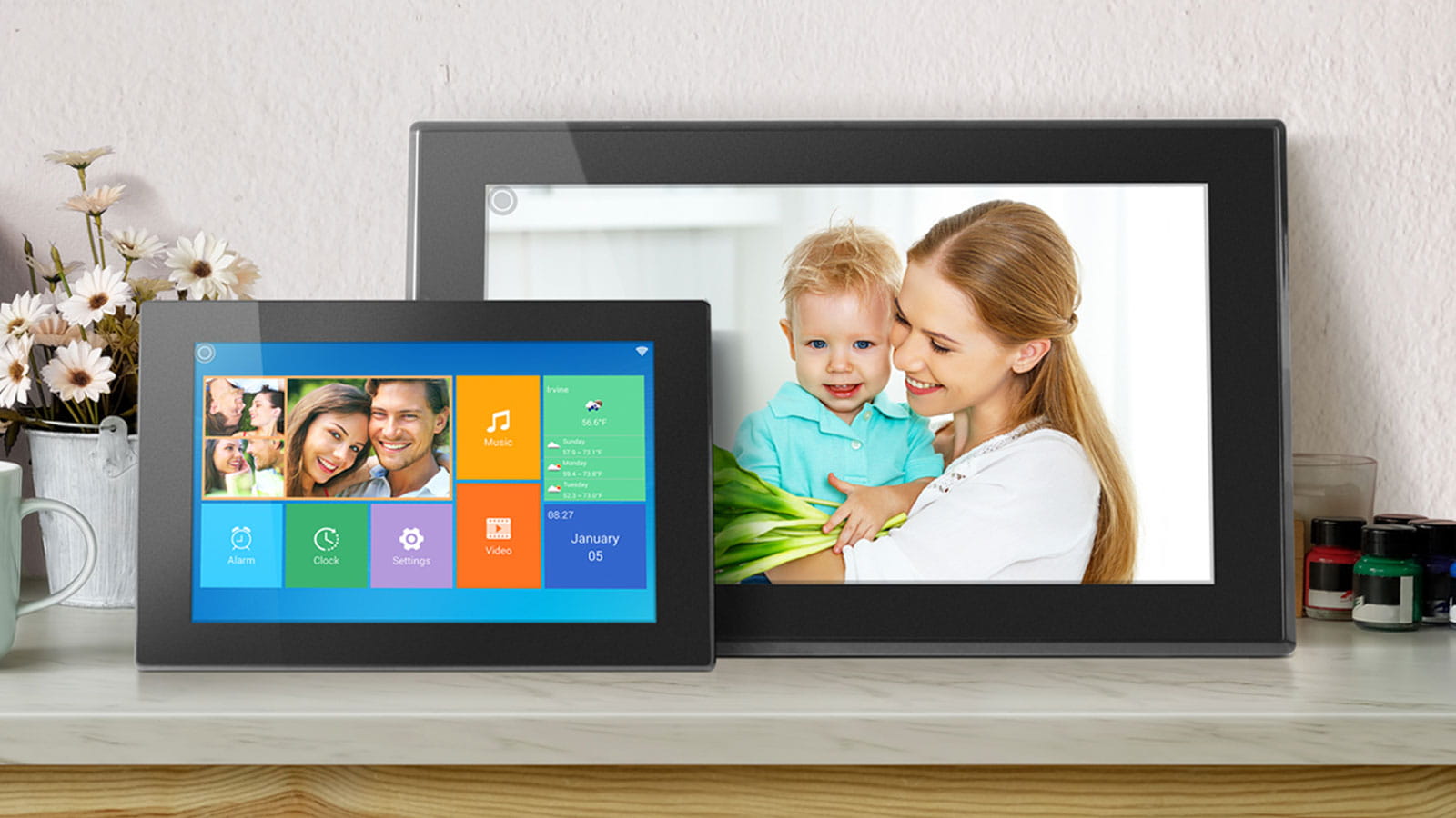 Aluratek digital photo frames sitting on a shelf