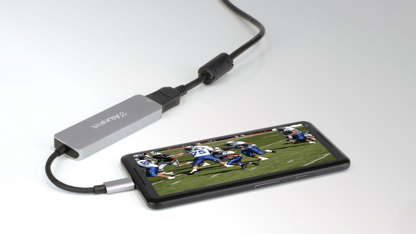 Aluratek USB Type-C Multimedia Hub and Card Reader with HDMI attached to phone