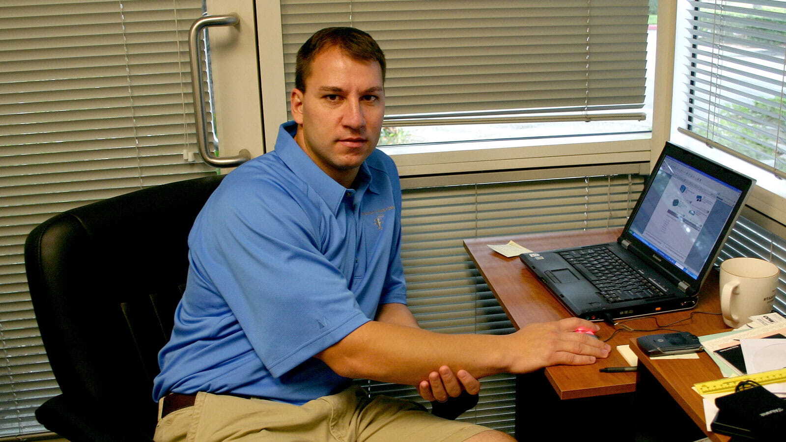 Celebrating 20 Years in Pictures - CEO working on his laptop