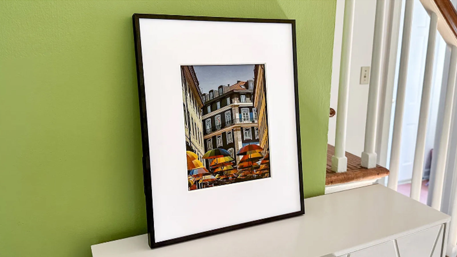 Aluratek ePaper 13.3 inch Wifi Digital Photo Frame sitting on table