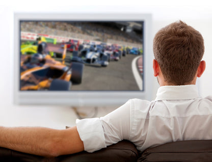Person watching cars racing on tv
